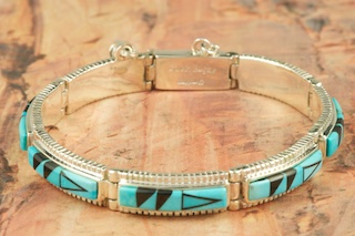 Genuine Sleeping Beauty Turquoise and Black Jade inlaid in Sterling Silver.  Stunning Bracelet Designed by Navajo Artist Calvin Begay. Signed by the artist.
